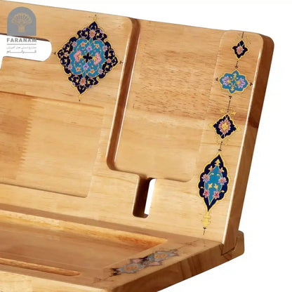 Wooden book stand with decorative elements on a white background